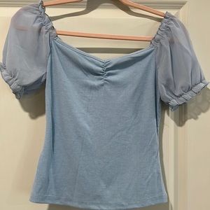 Fitted top with sheer short sleeves in baby blue color